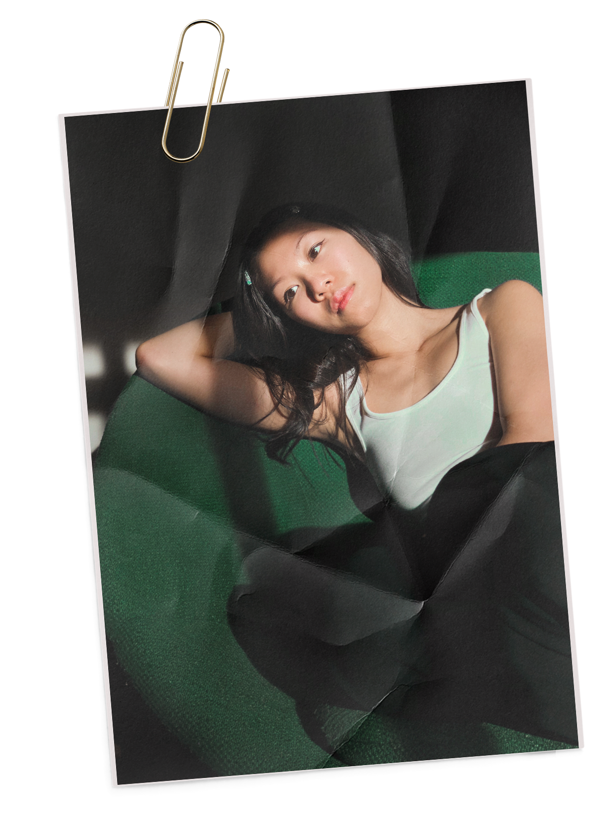 A portrait of Amanda, sitting in a chair.